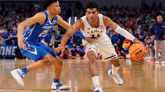 Creighton guard Trey Alexander (23) defends as Kansas guard Remy Martin (11) works to the basket in the first half of a second-round game in the NCAA college basketball tournament in Fort Worth, Texas, Saturday, March, 19, 2022.